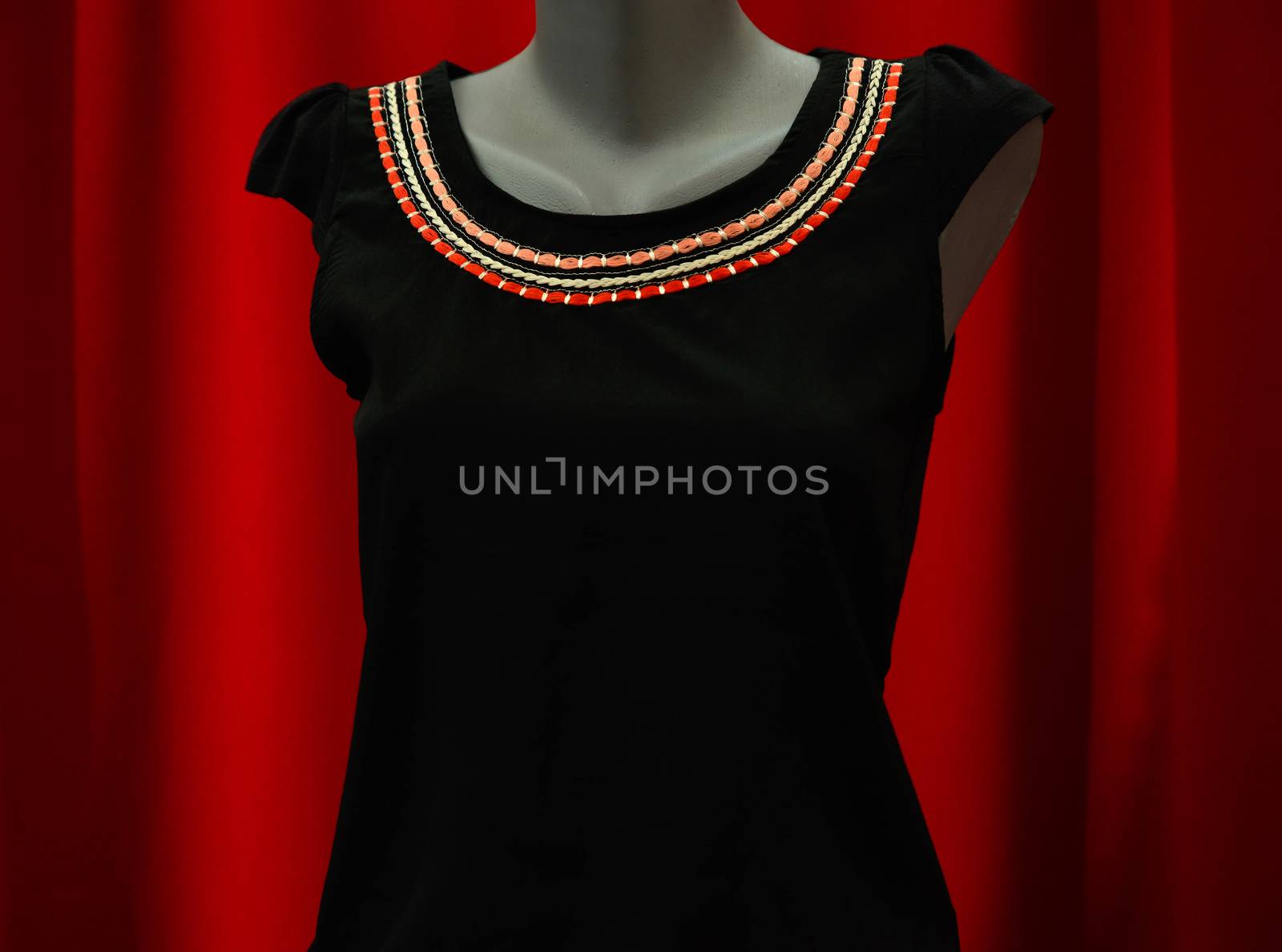 picture of a fashion summer clothes on a manequin doll on a red background