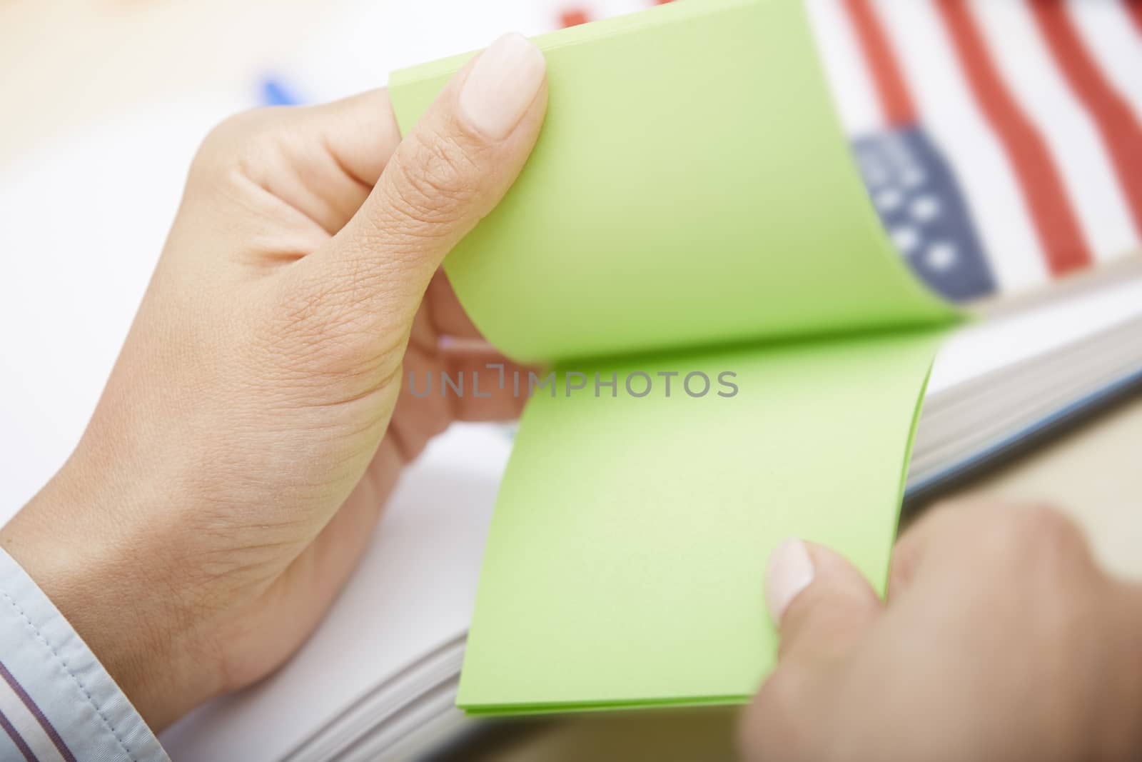 Human hands holding adhesive note with with empty space