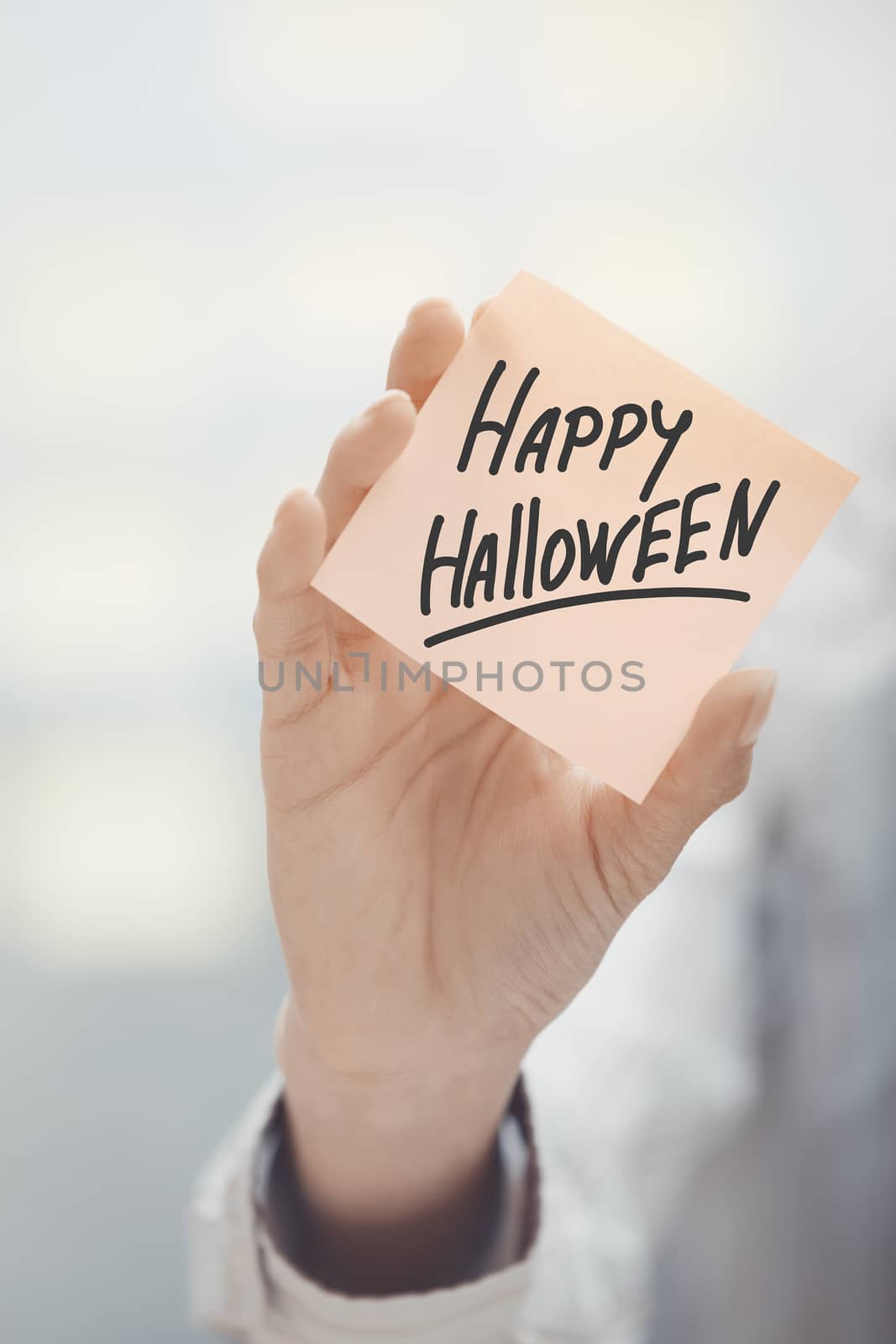 Woman holding agenda with Happy Halloween text by Novic