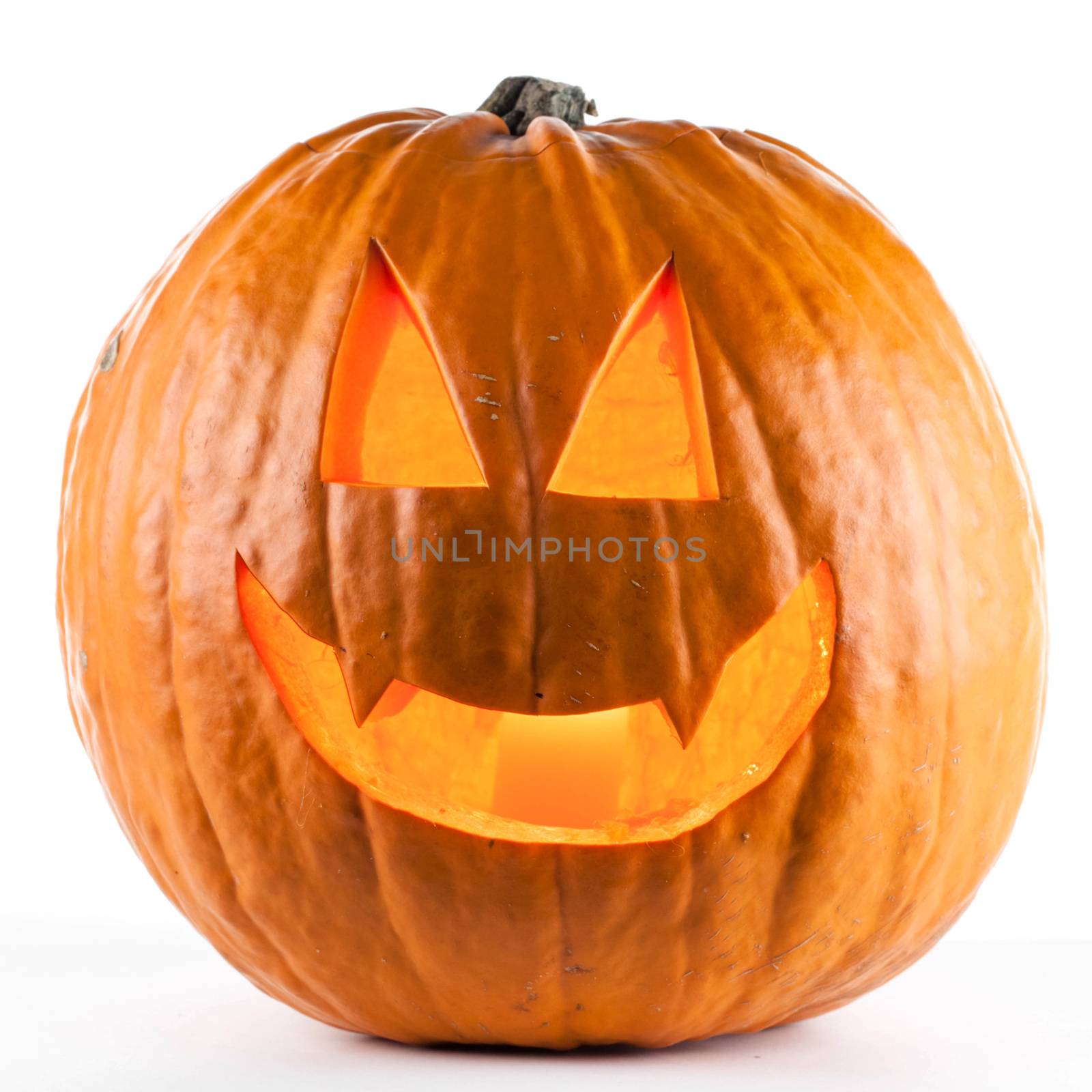 Glowing Halloween pumpkin isolated on white background