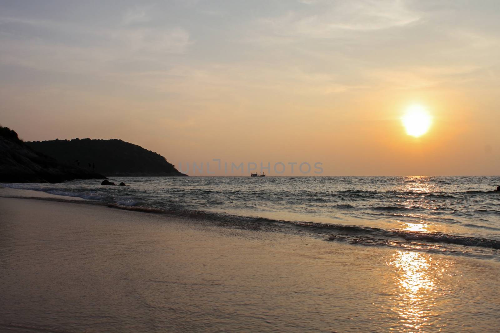 a silhouette rocks at sunset on seashore. Sunset landscape of sea, southern Thailand, Phuket Island