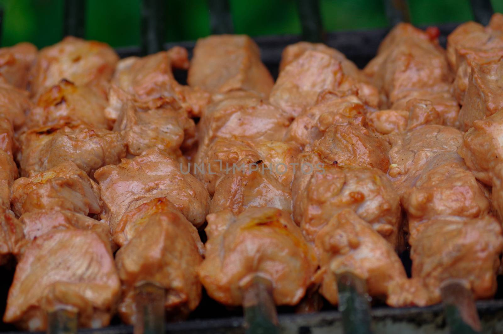 Shashlik on skewers closeup, raw and cooked by evolutionnow