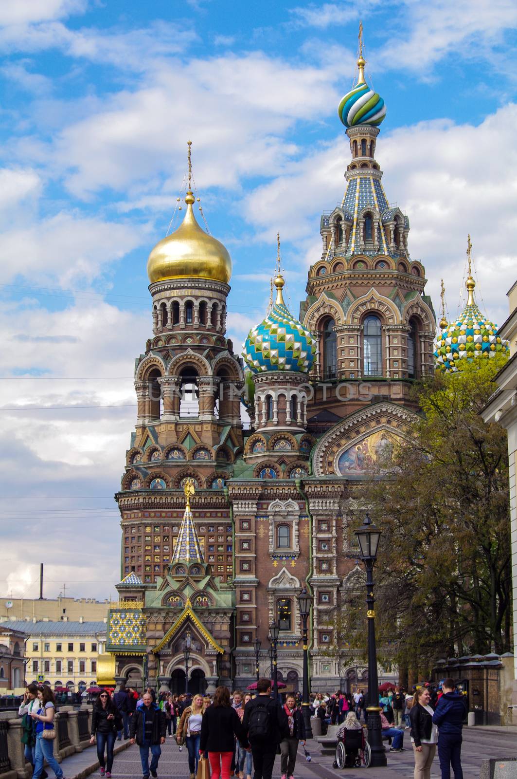 SAINT PETERSBURG, RUSSIA - MAI 10, 2014: walking people in front of church the Savior on Spilled Blood. Spas-na-krovi cathedral The cathedral Has rescued - on - blood 