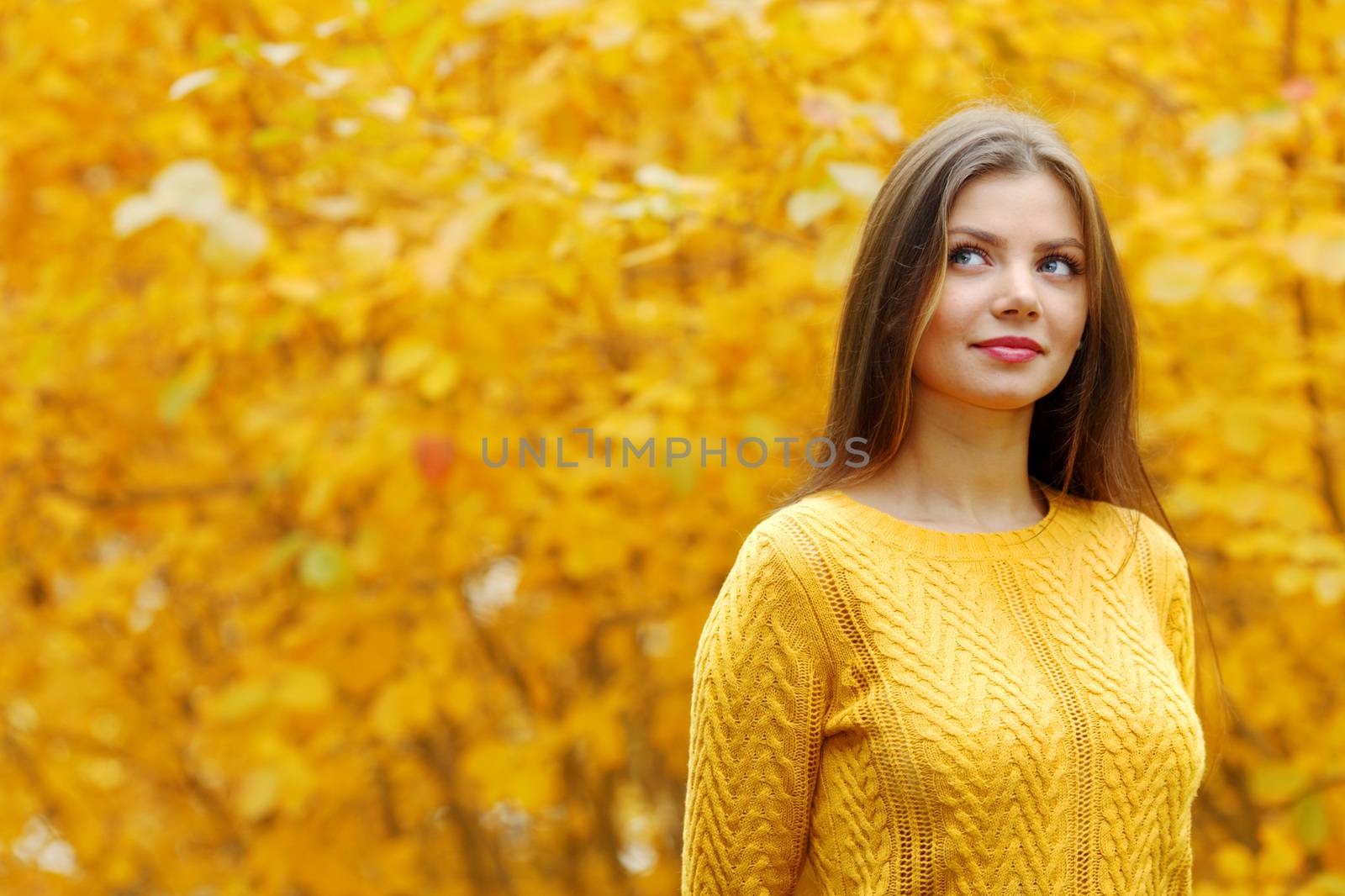 Autumn portrait of happy lovely and beautiful young woman