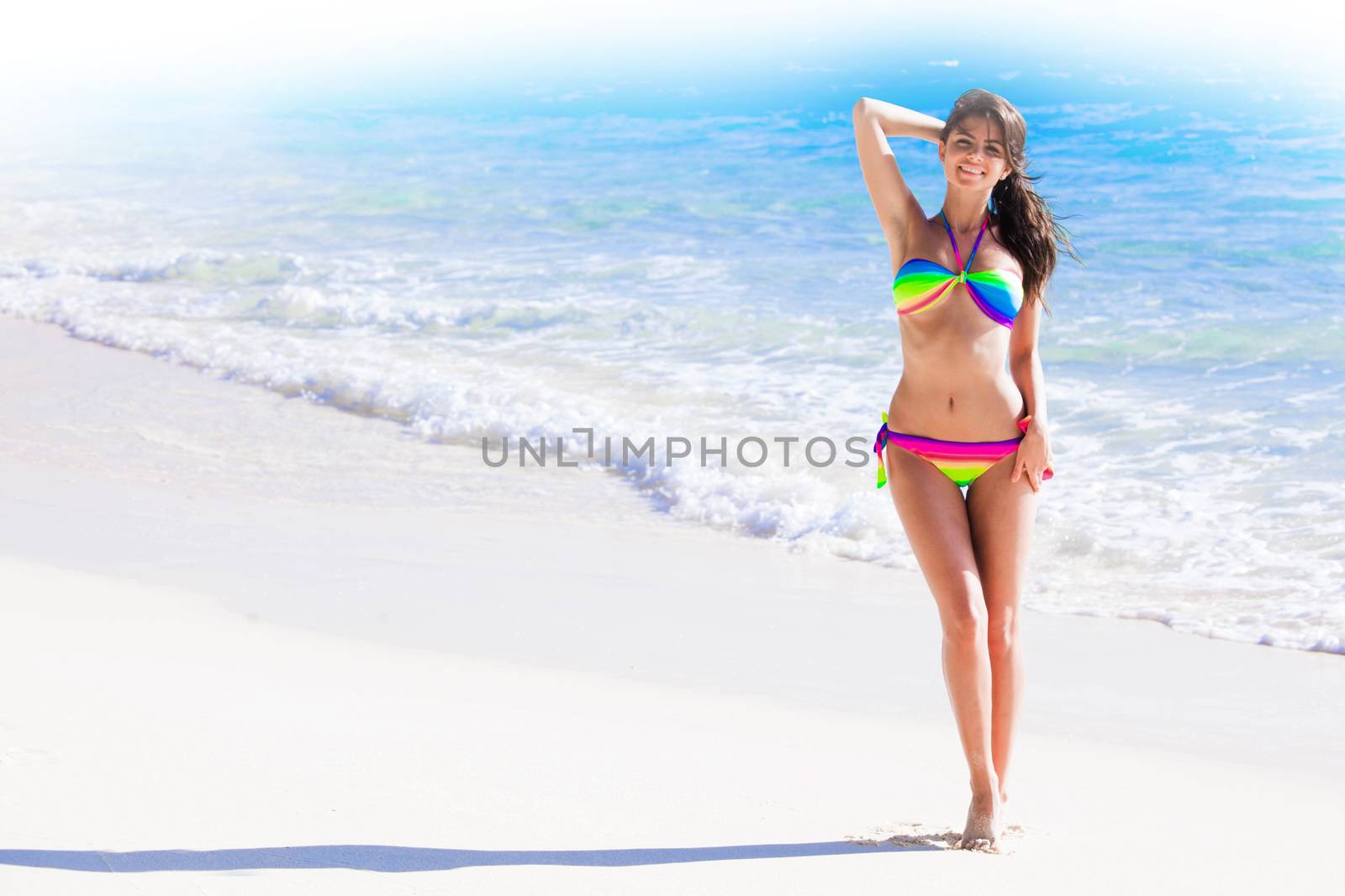 Beautiful woman in bikni on tropical beach