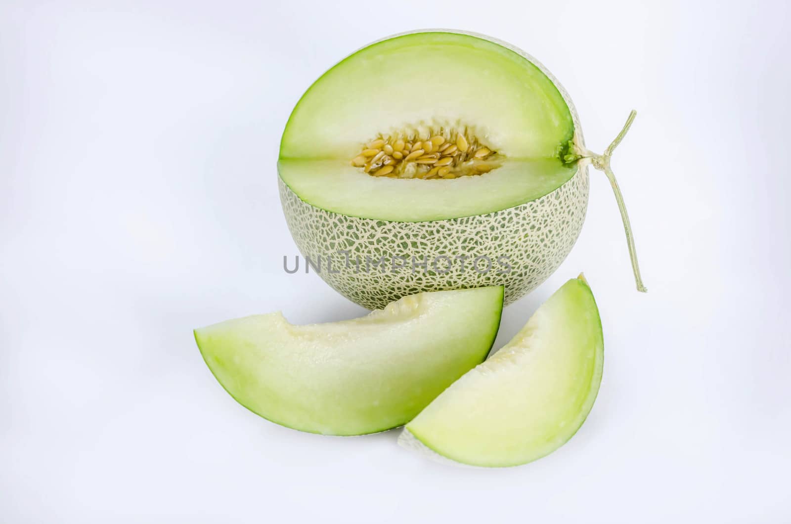 shopped green melon isolated on white background