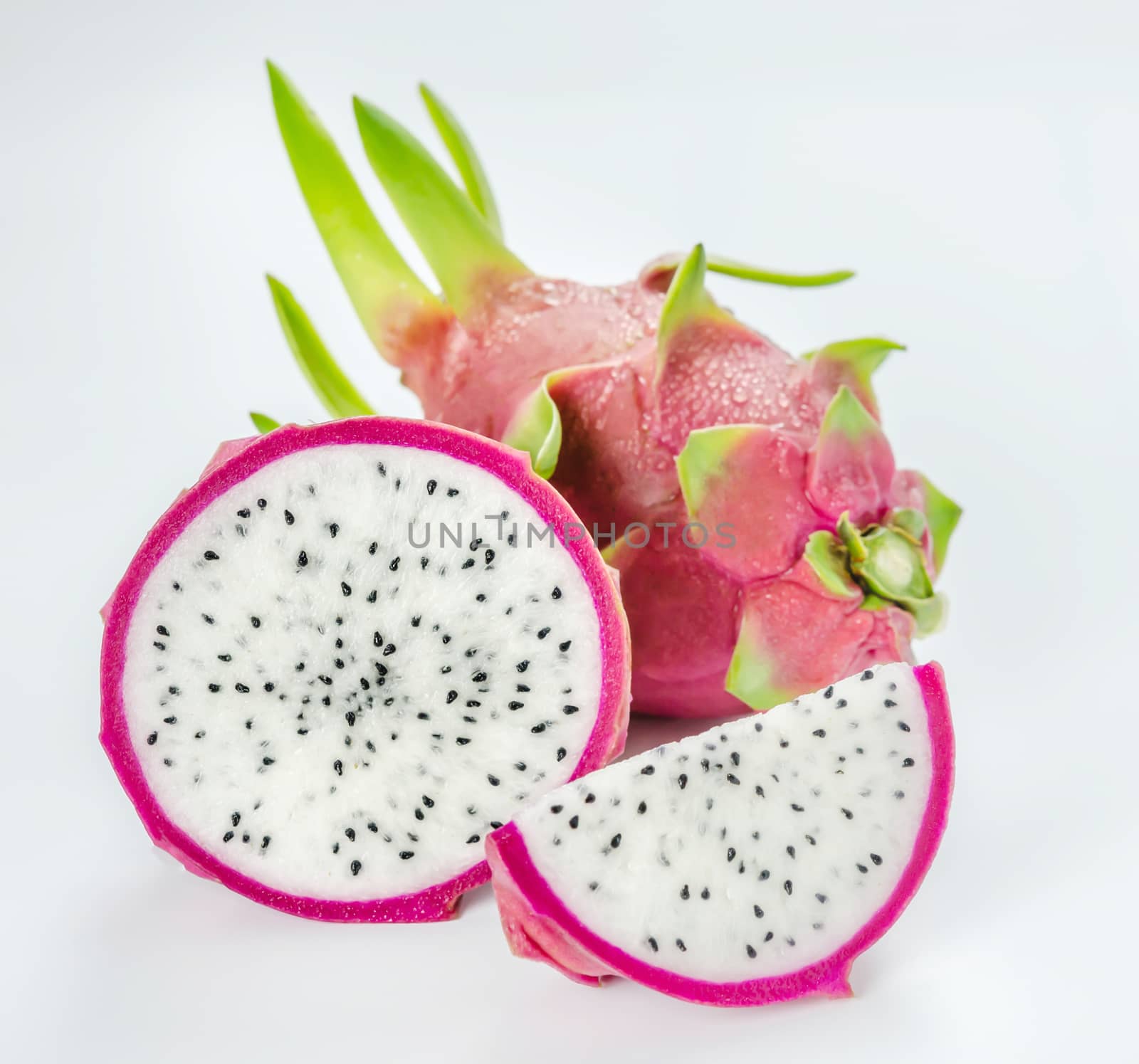 Ripe Dragon fruit or Pitaya with slice on white background