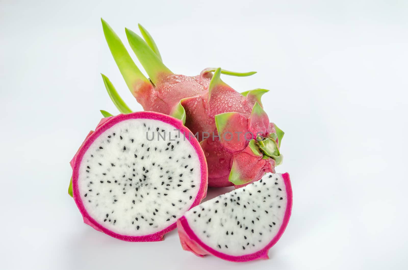 Ripe Dragon fruit or Pitaya with slice on white background