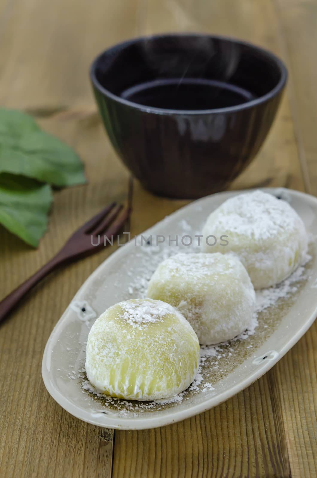 Daifuku Mochi Japanese dessert on dish with  hot tea , still life