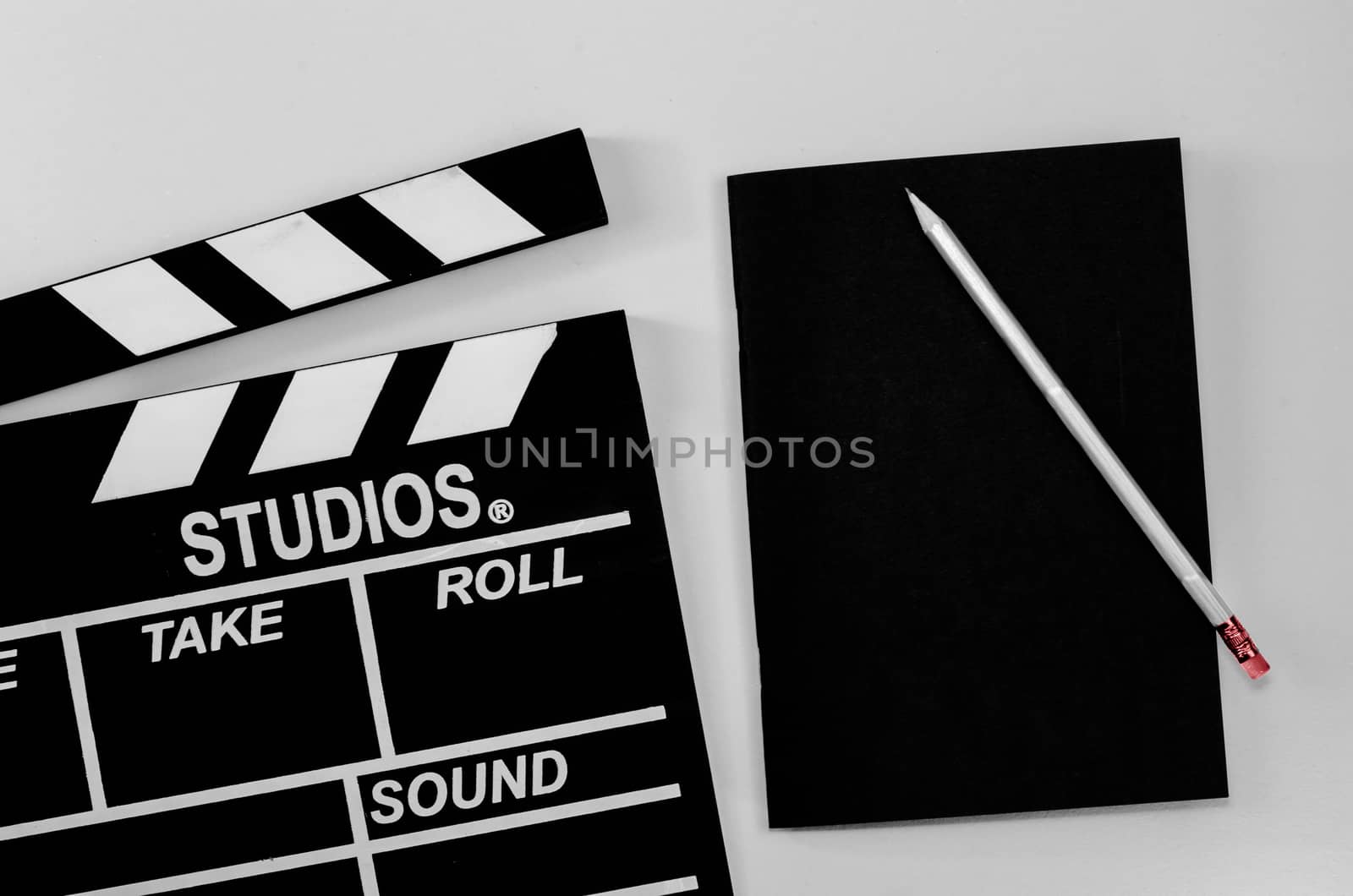 Slate film and black notebook white background