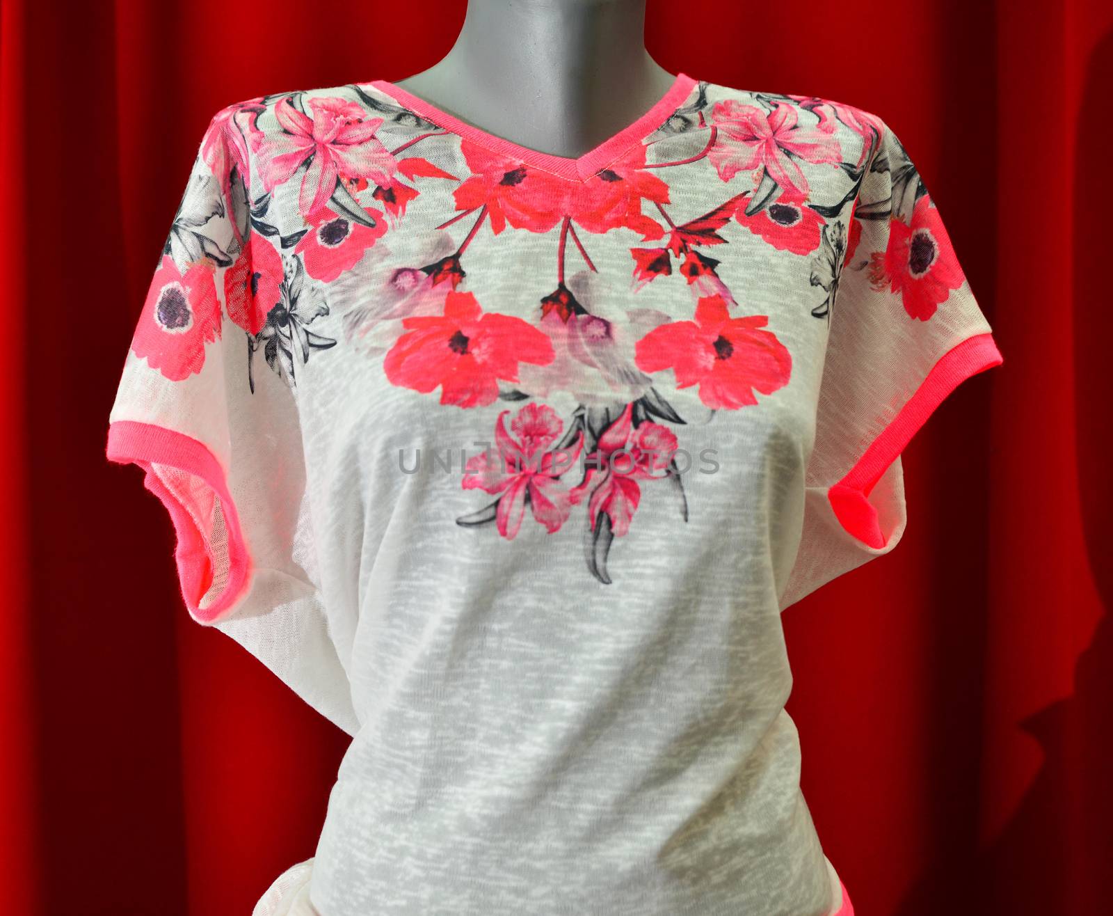 picture of a fashion summer clothes on a manequin doll on a red background