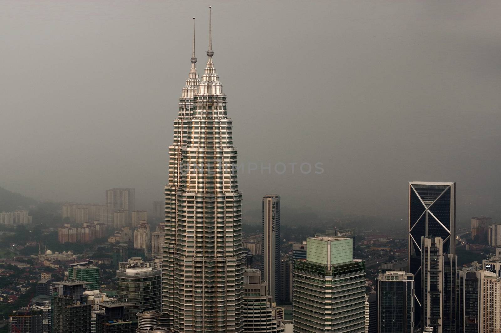 Kuala Lumpur, Malaysia - November 17. 2016: Dramatic scenery of the KualaLumpur city at sunset, from the KL-Tower Menara KL . by evolutionnow