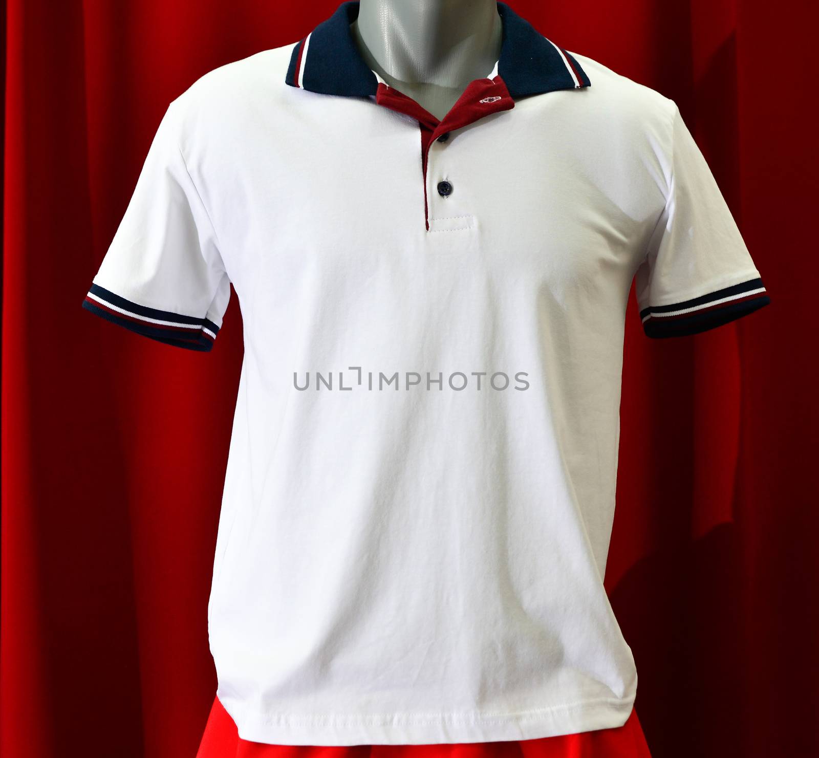 picture of a fashion summer clothes on a manequin doll on a red background