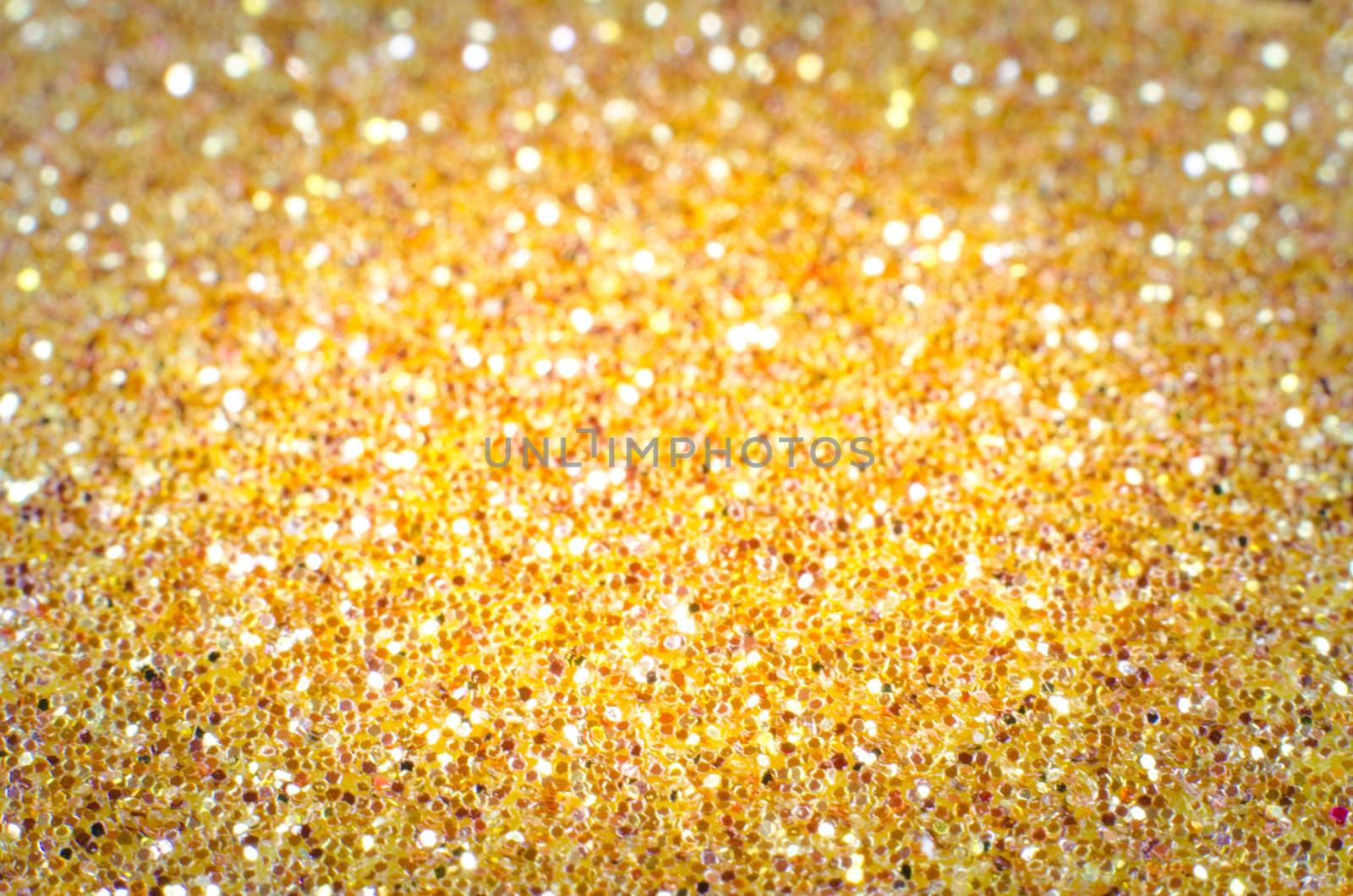 Gold defocused Christmas festival glitter background with copy space