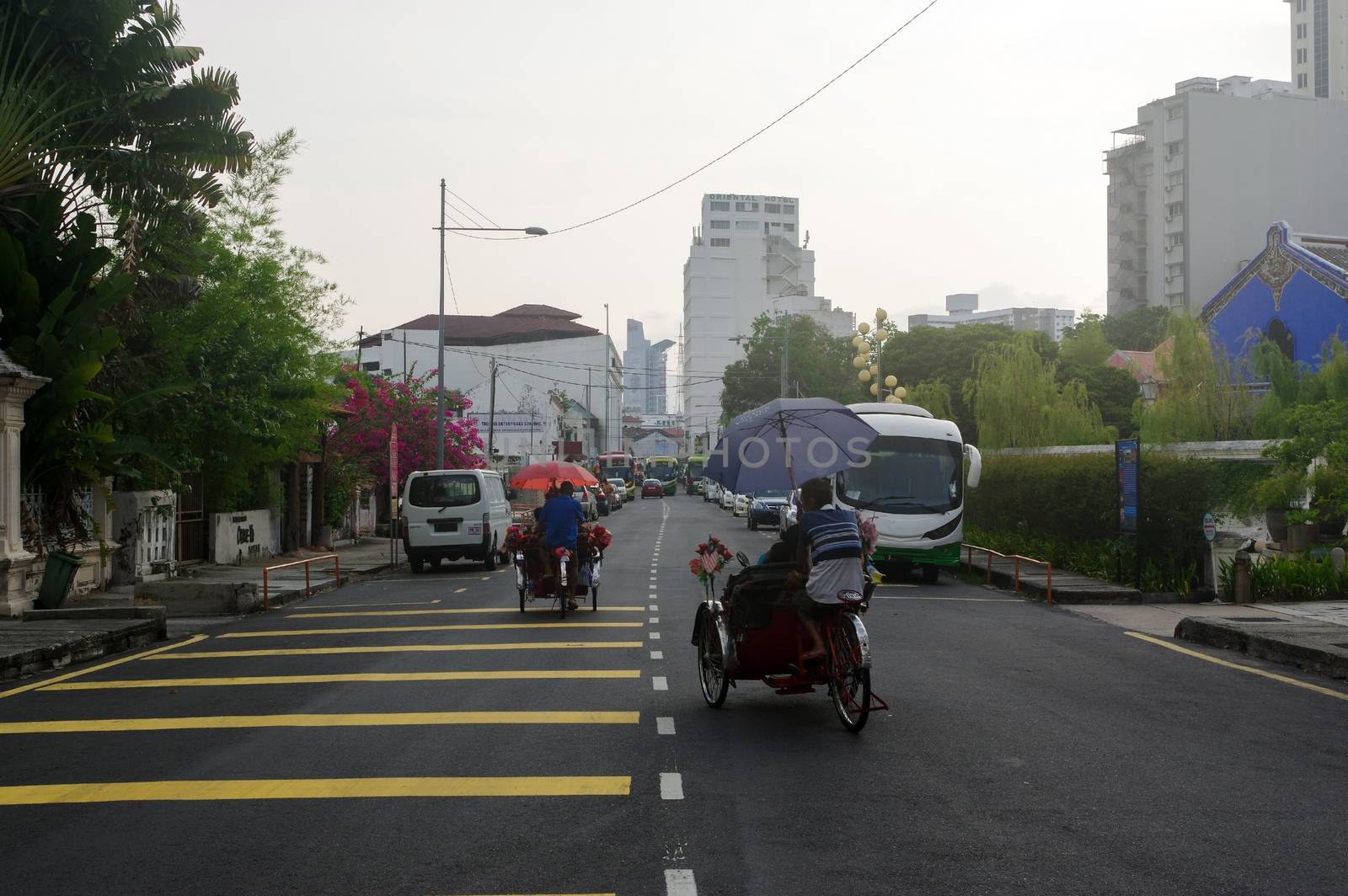 Georgetown, Penang, Malaysia - April 18, 2015: Classic local rickshaw in George Town, Penang in Malaysia by evolutionnow