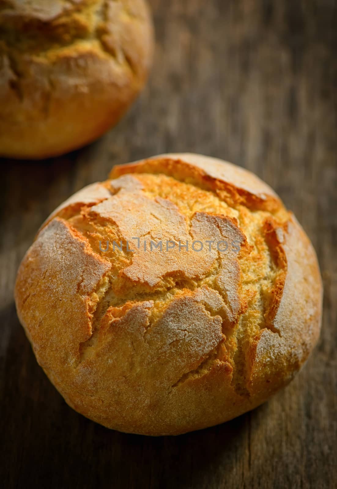 traditional homemade round bread on wooden table