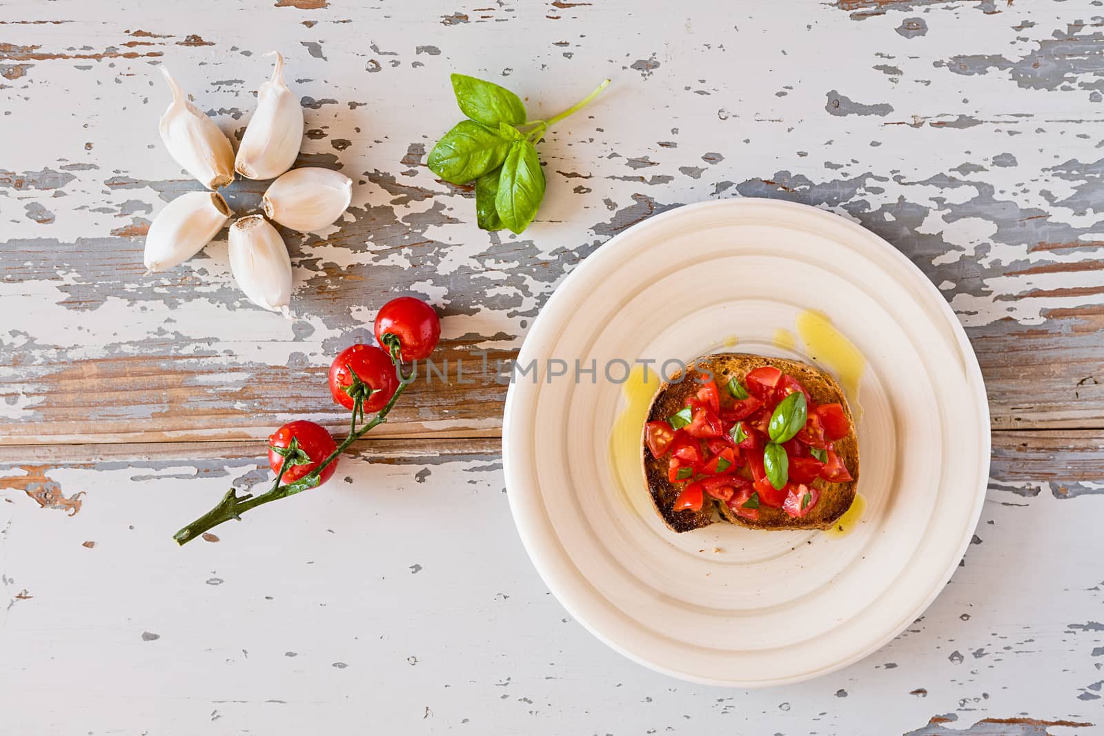Italian bruschetta with tomato and basil seen from above by LuigiMorbidelli