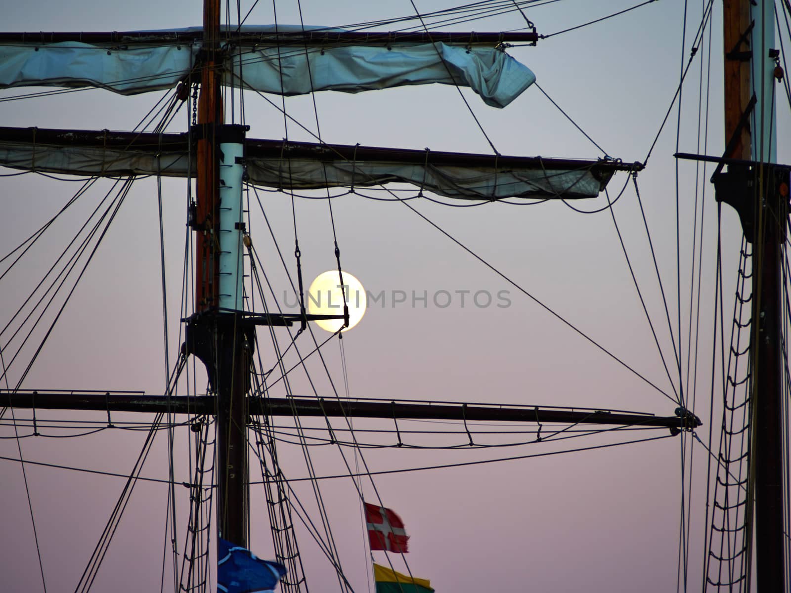 Sailing yacht tall ship illuminated by the light of a full moon great boating sailing background image