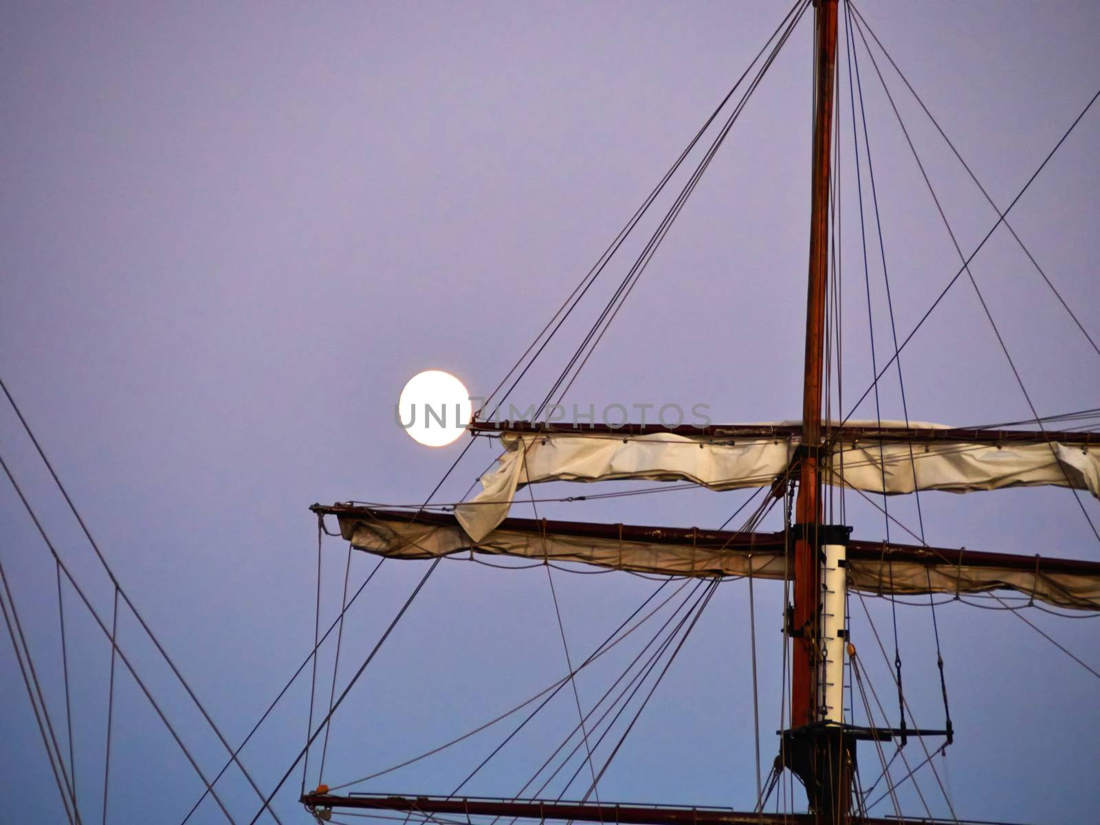 Sailing yacht tall ship illuminated by the light of a full moon by Ronyzmbow