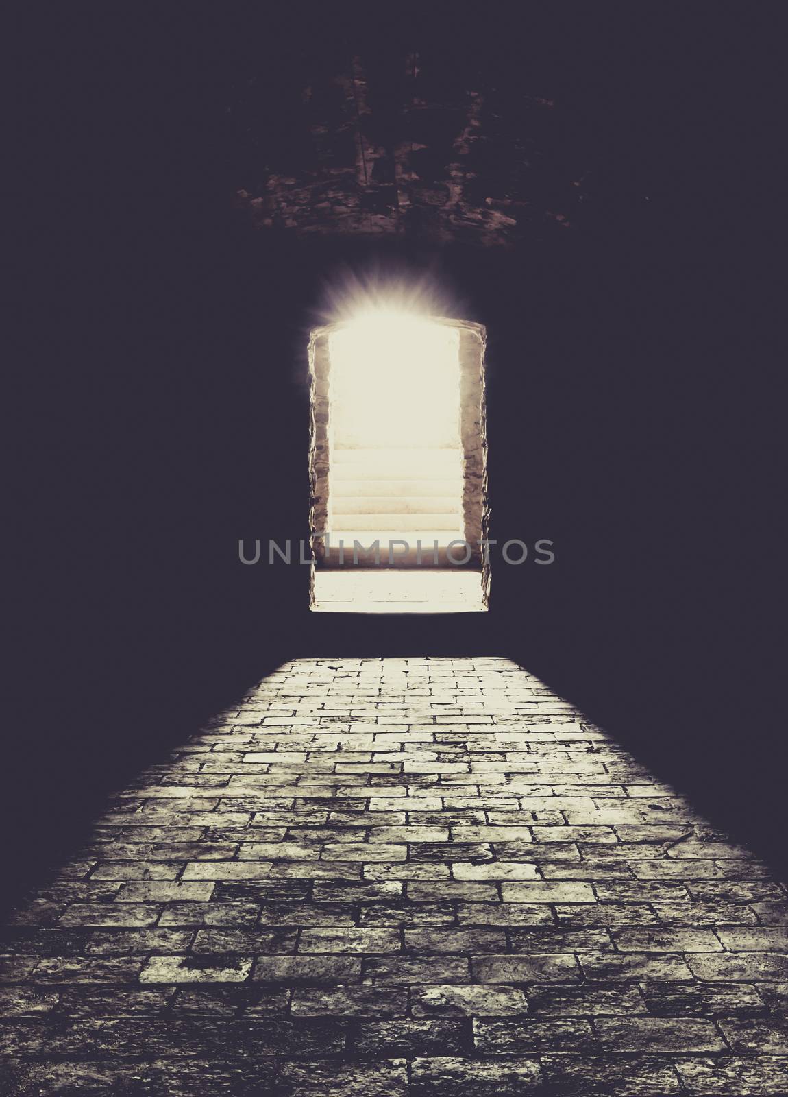 Conceptual image with a basement interior, the strong sun lights coming over the stone stairs and floor