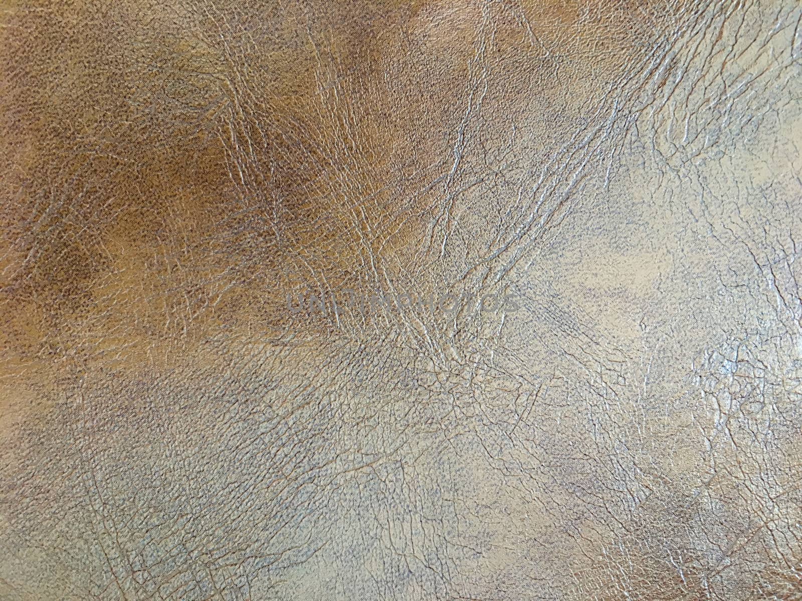 Light on brown imitation leather background
