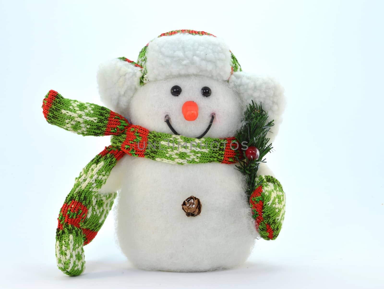 Snowman with a branch and a green and red scarf.