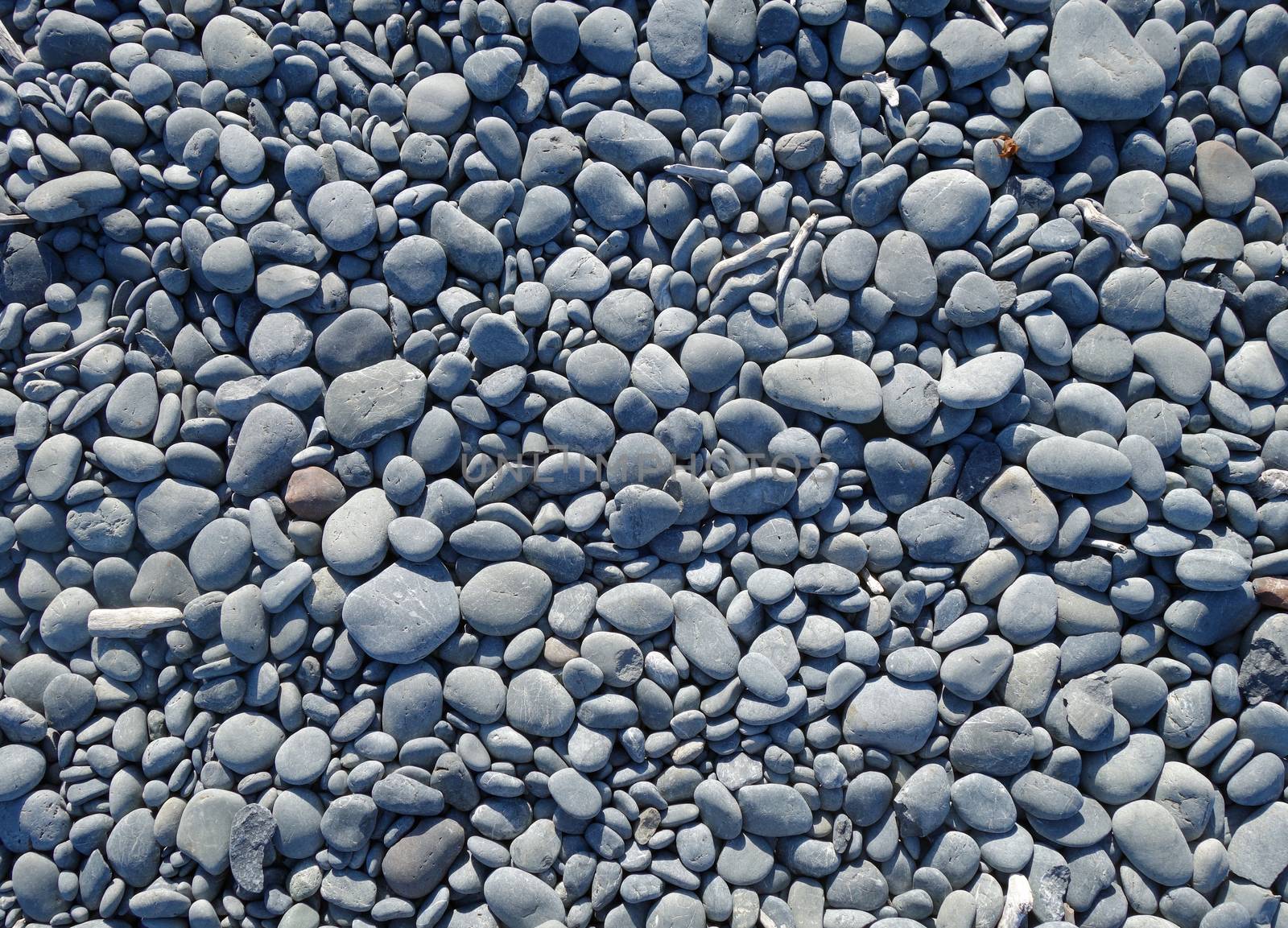 pebbles on a beach background texture wallpaper                               