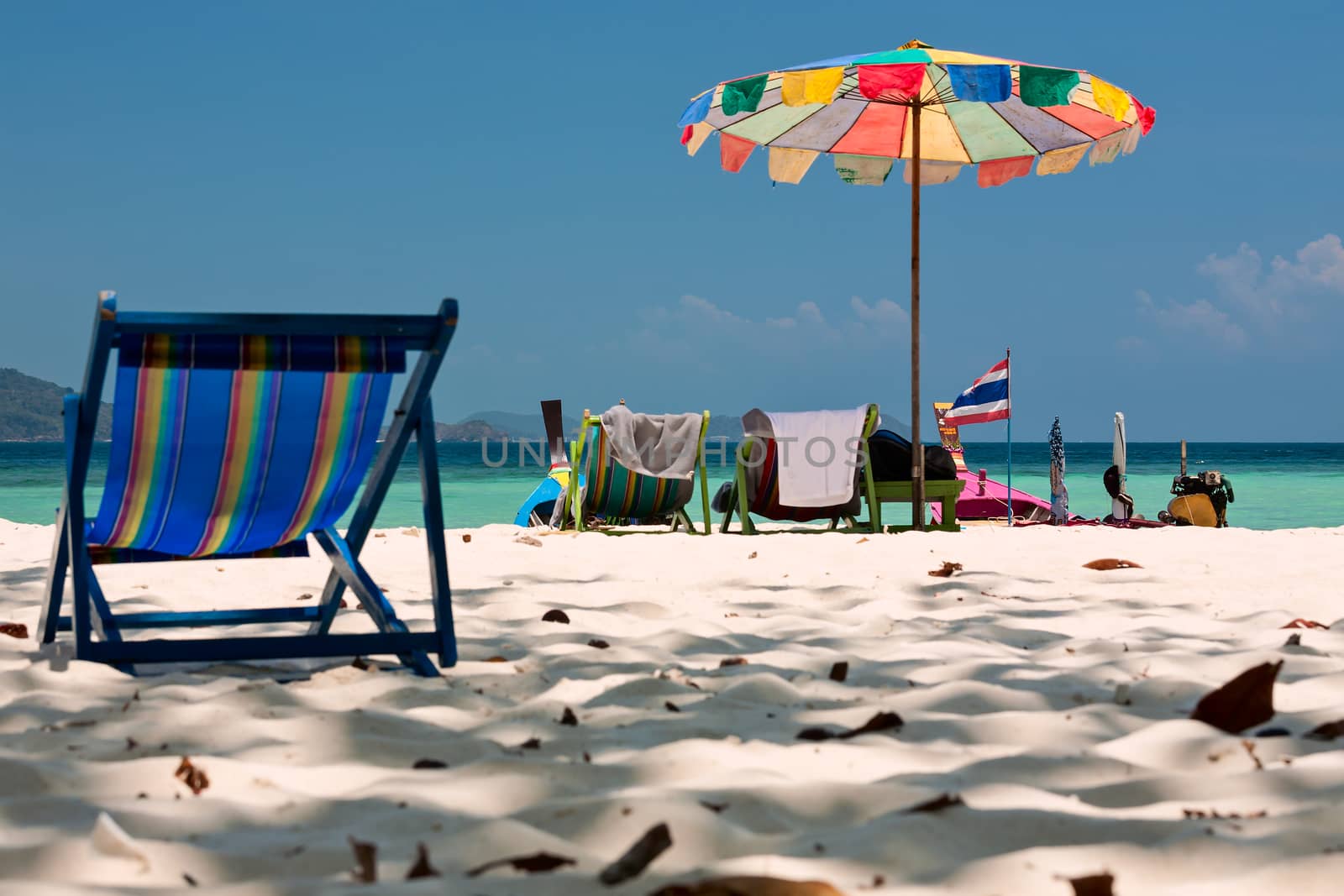Beach umbrella and chairs in Komodo beach in Coral island, Thail by LuigiMorbidelli