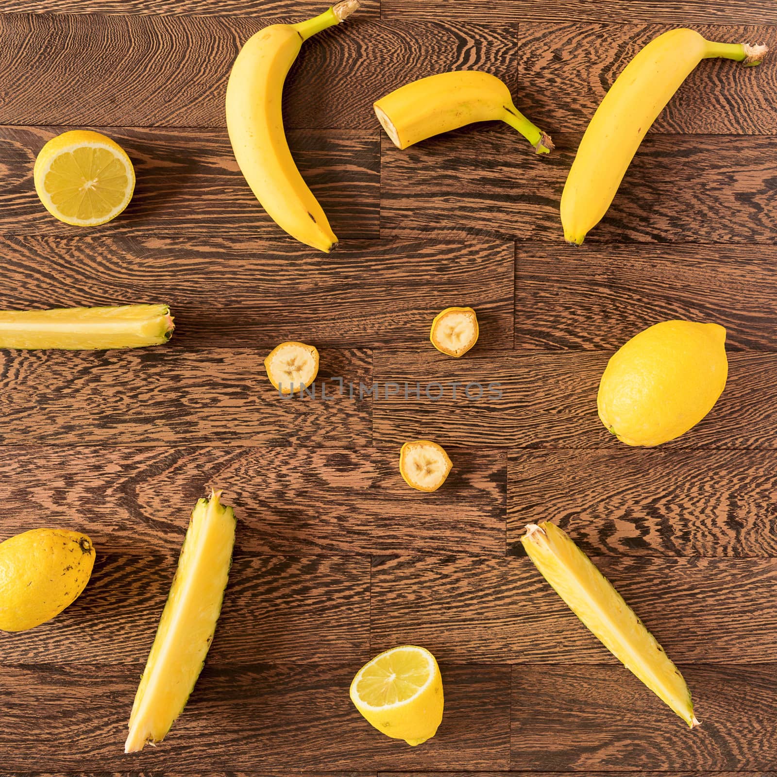 Yellow colored fruit over a wooden background