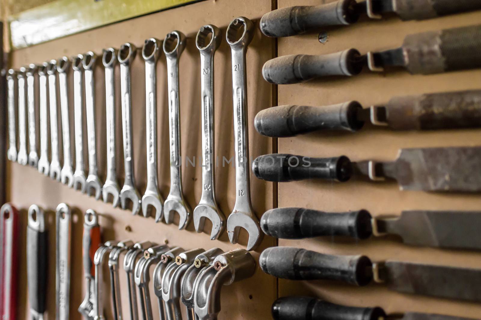 Set of wrenches. Wrenches in several different sizes hanging in the garage