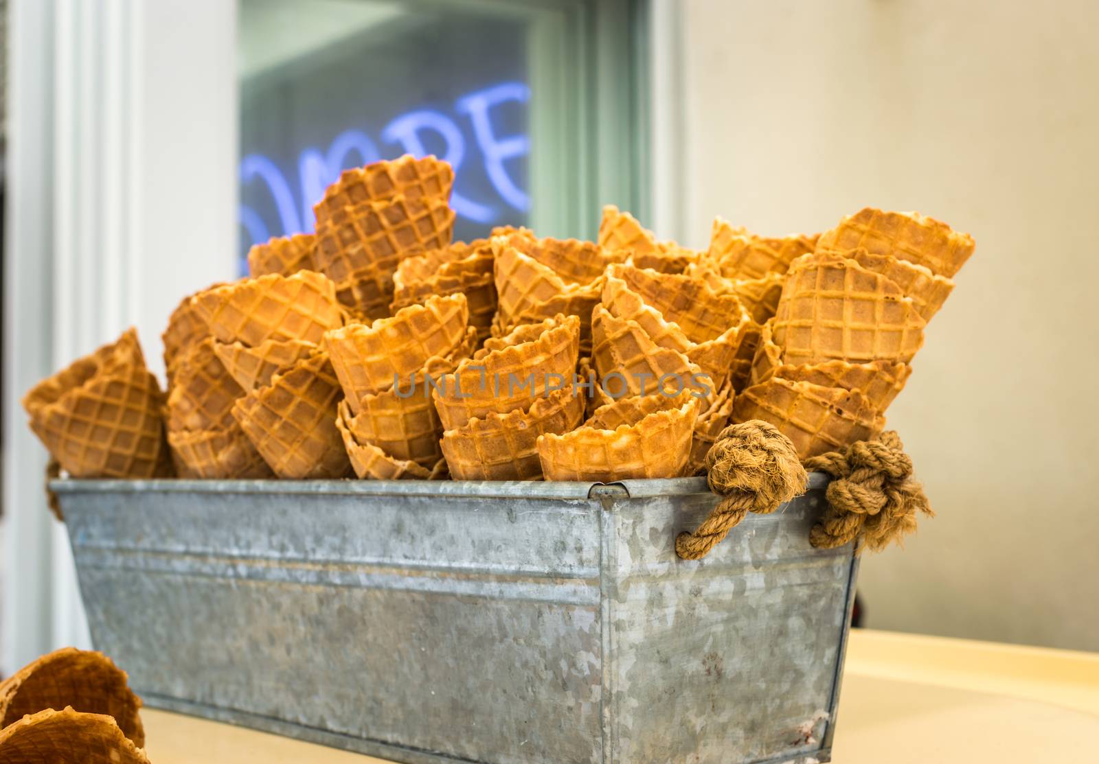 Delicious wafer cups for ice-cream in an iron bowl