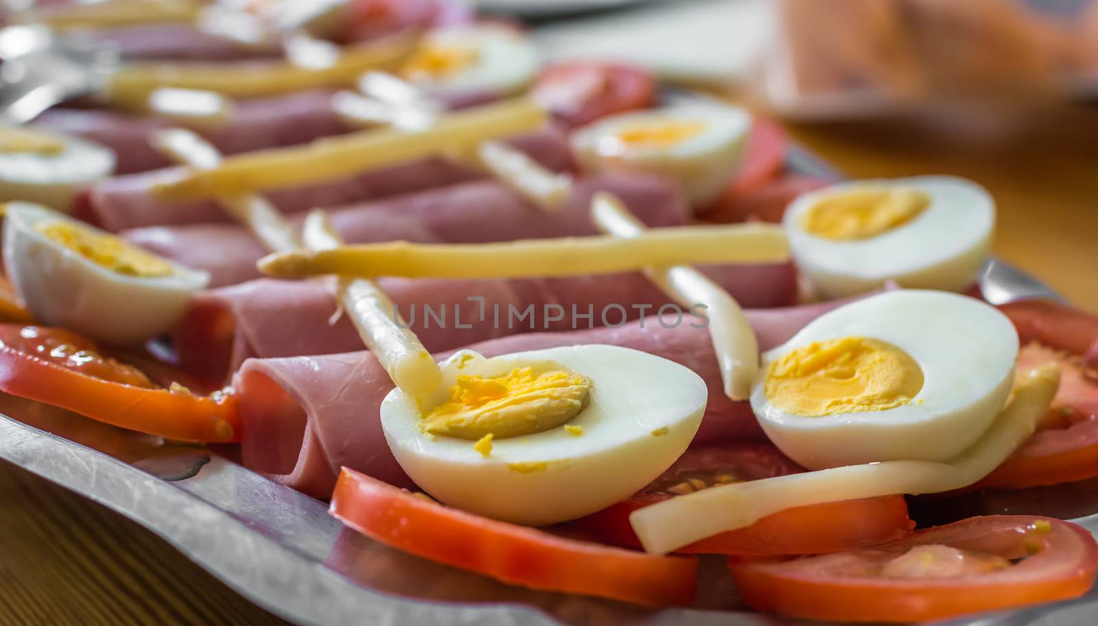 half boiled eggs, sliced tomatoes, ham and asparagus by okskukuruza