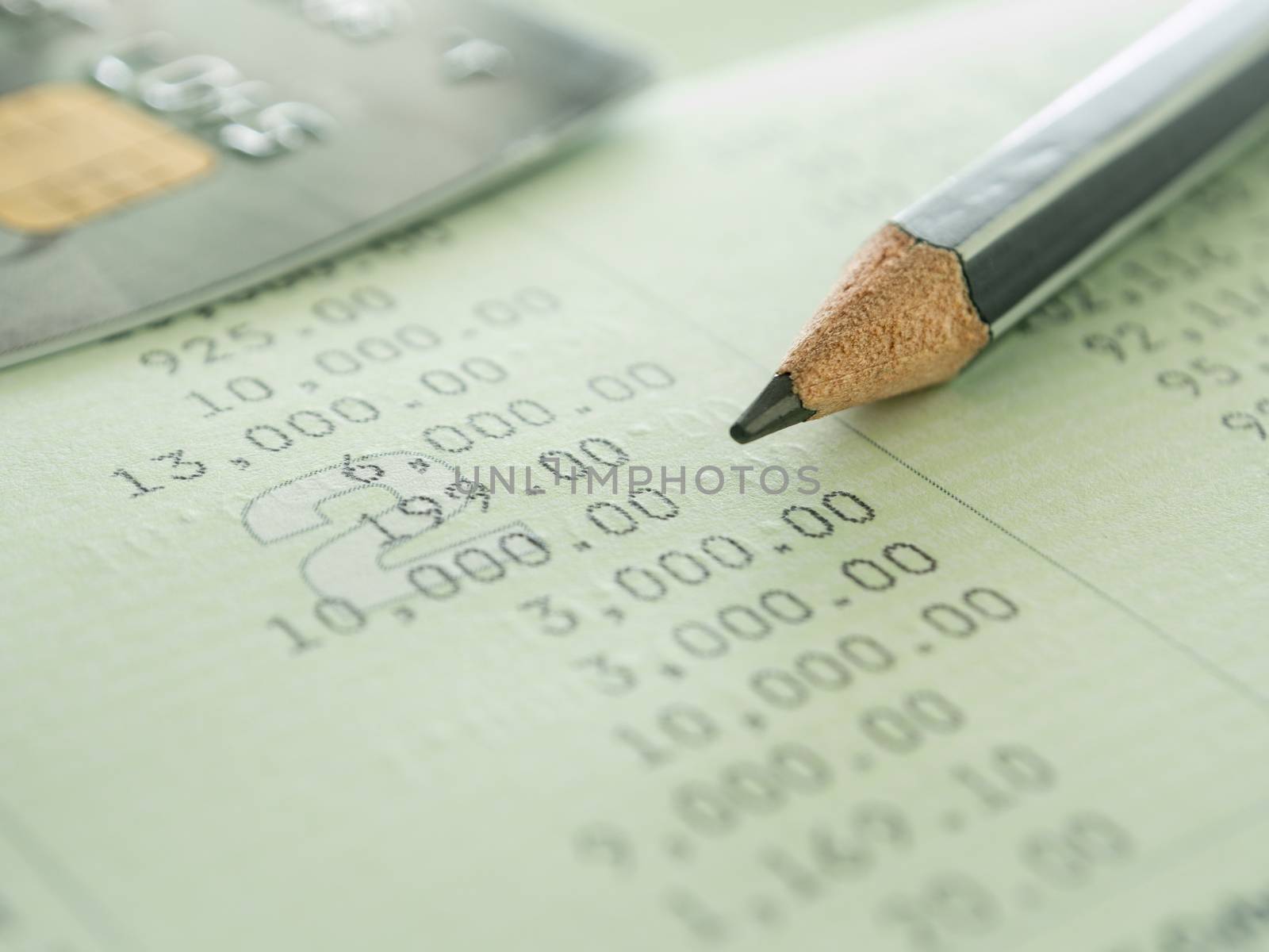 pencil and creditcard on passbook. selective focus.