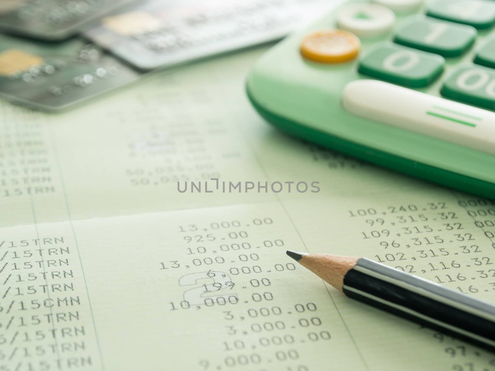 pencil ,calculator, creditcard on passbook. selective focus.
