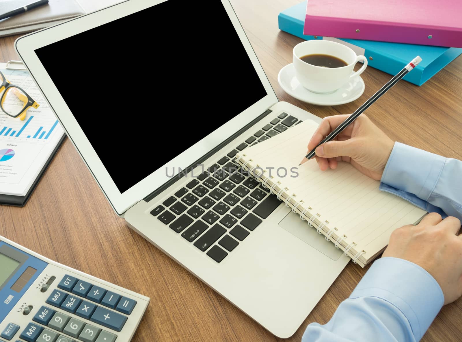 businessman record data on to schedule a meeting or event