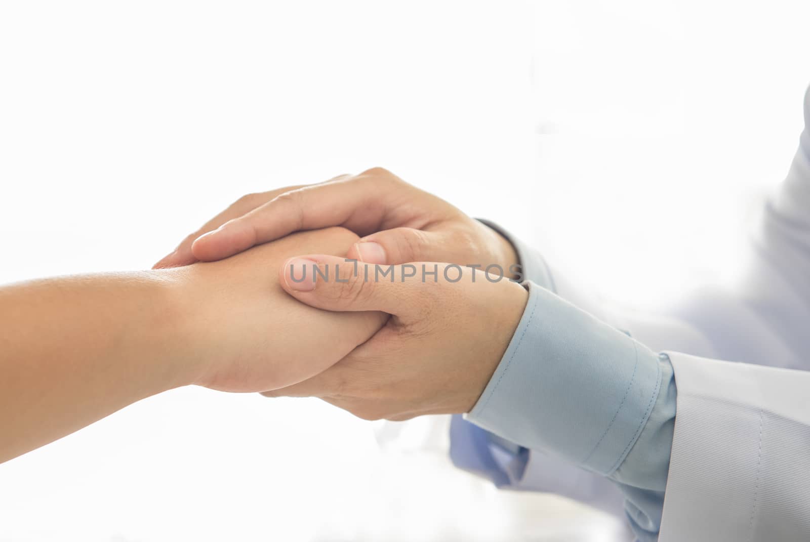 closeup hand of doctors comforting him patients