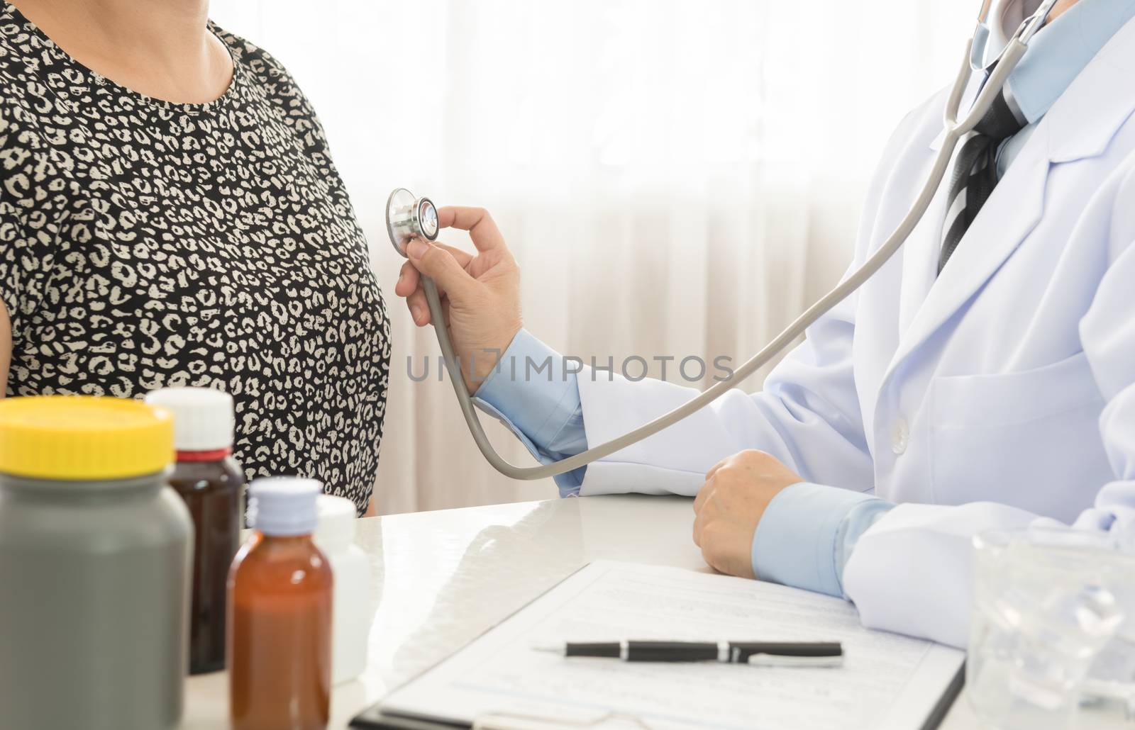 women being examined by doctor in clini