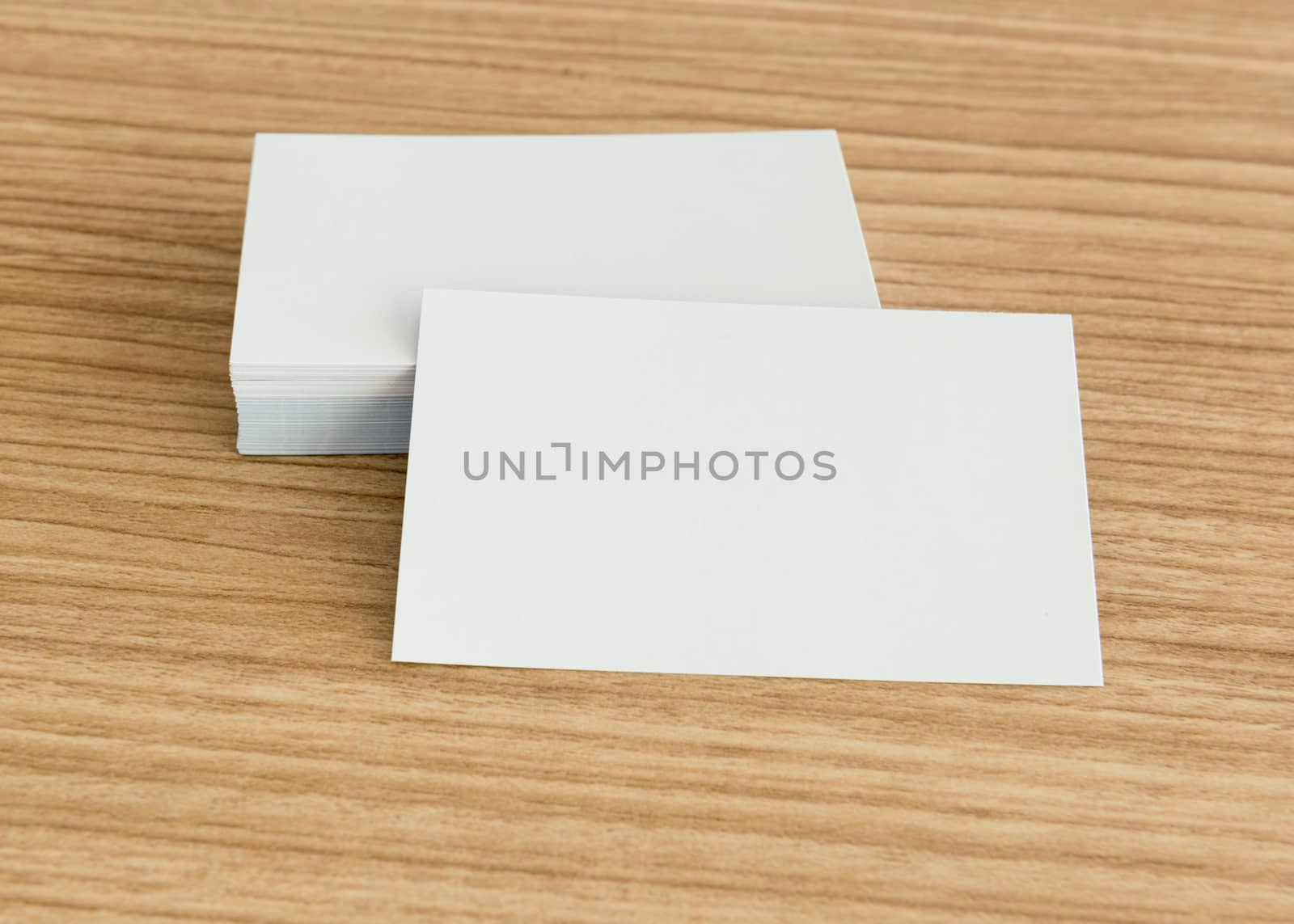 blank business cards on wooden background. free space for text.