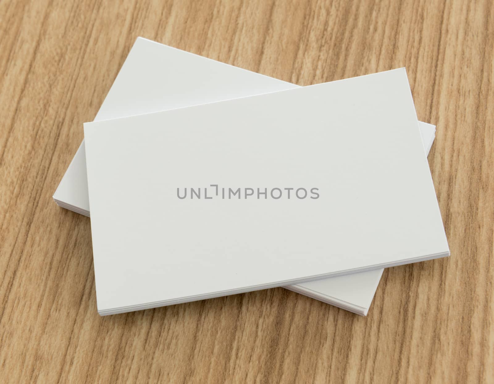 blank business cards on wooden background. free space for text.