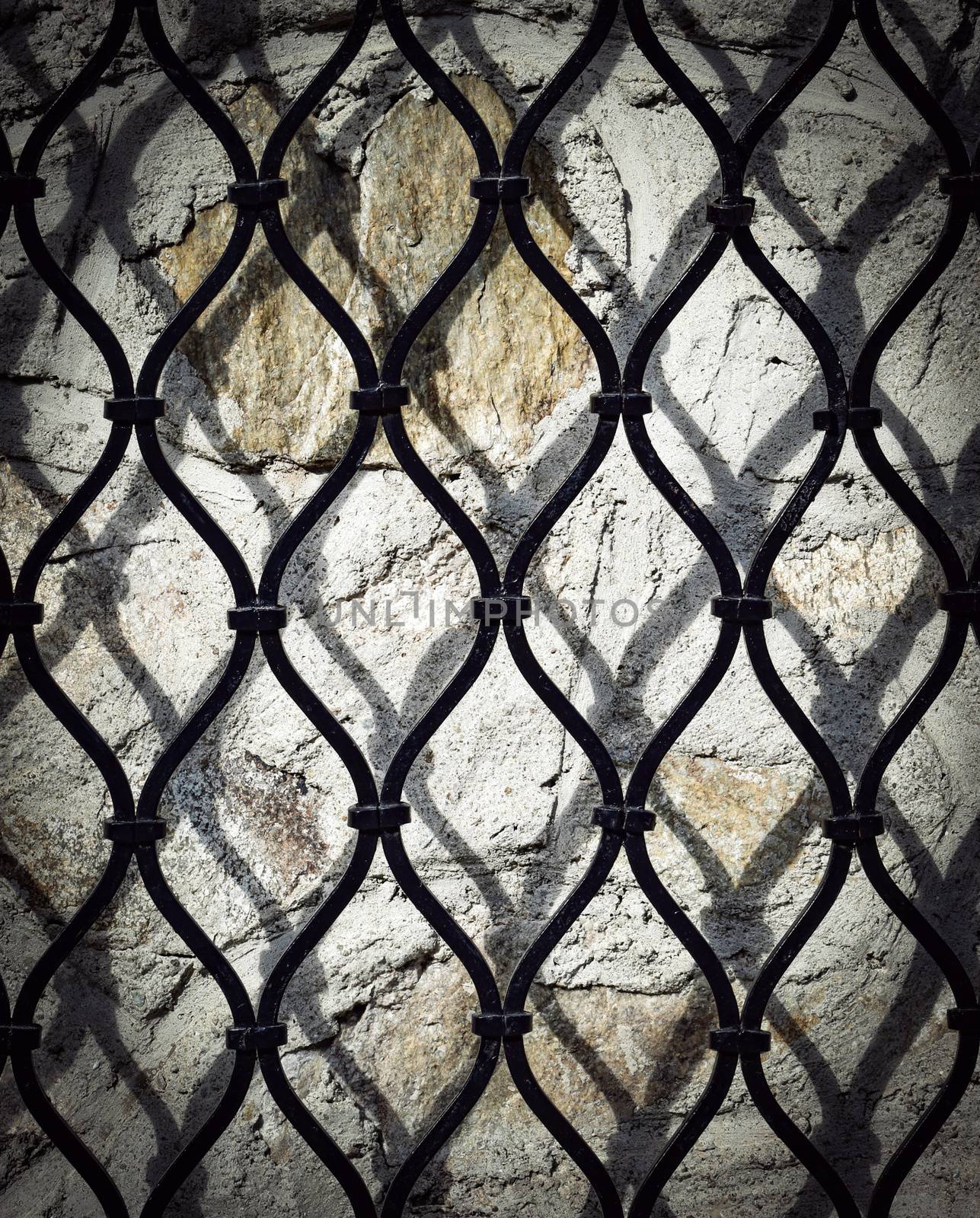 abstract background black iron grid on a stone wall