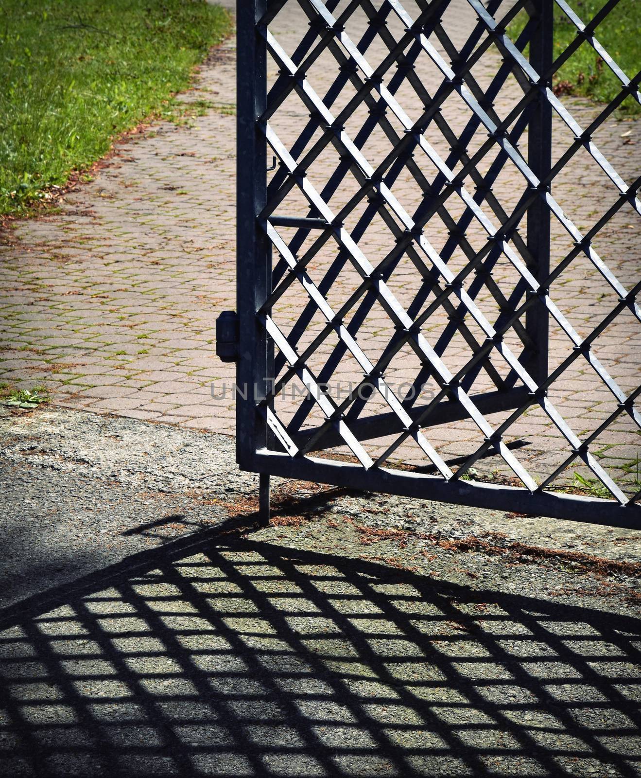 forged iron gate open with shadow by Ahojdoma