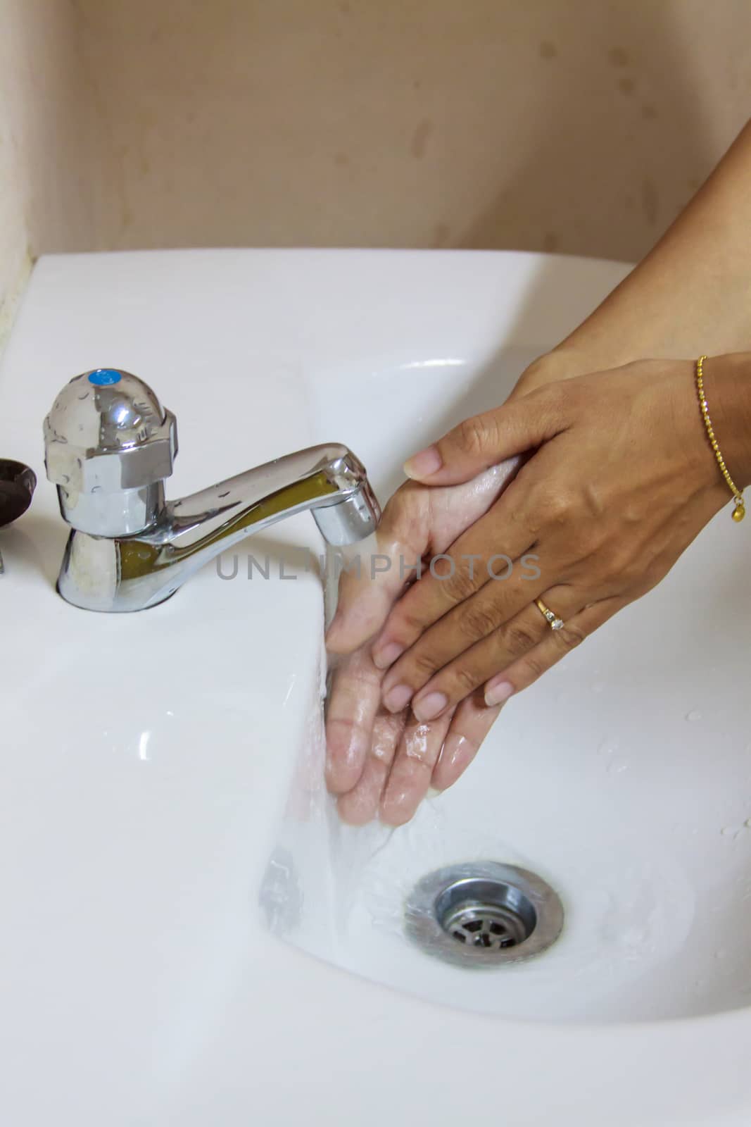 Woman Washing Hands. Cleaning Hands. Hygiene by worrayuth