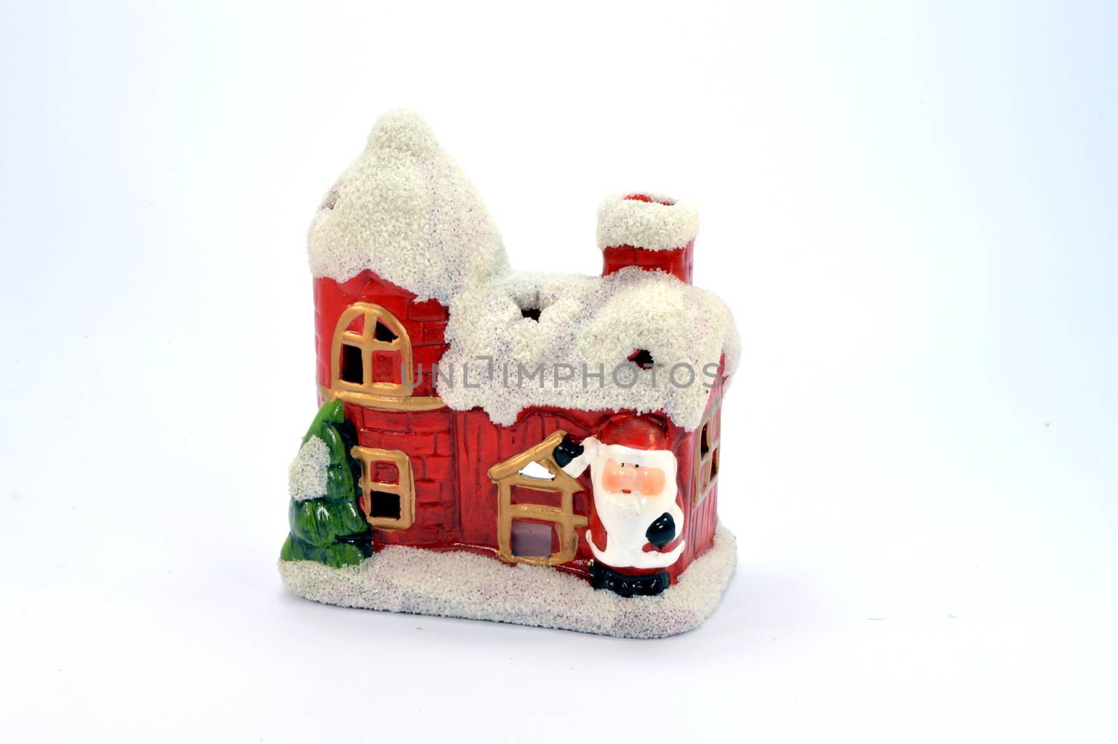 Small house of Christmas in toy with a fir tree and the Santa Claus