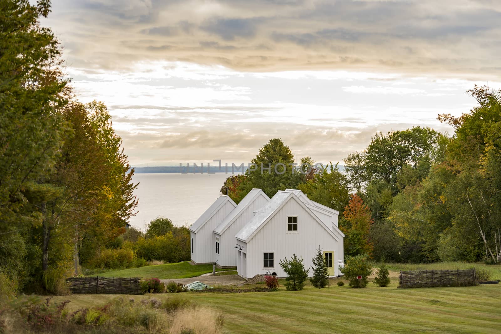 New England traditional house in the fall by edella