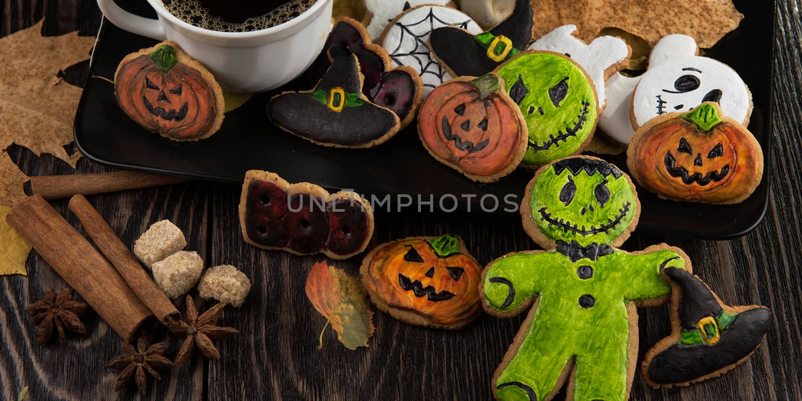 Homemade delicious ginger biscuits for Halloween on wooden table