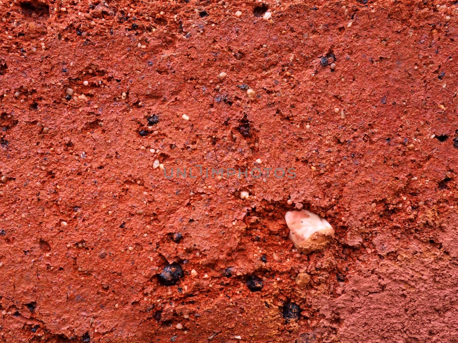 Surface of red brick in close-up as a texture. Macro photo.