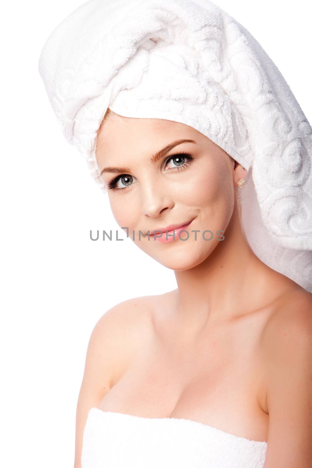 Beautiful clean happy woman with hair wrapped in towels after shower bath, hygiene concept, on white.