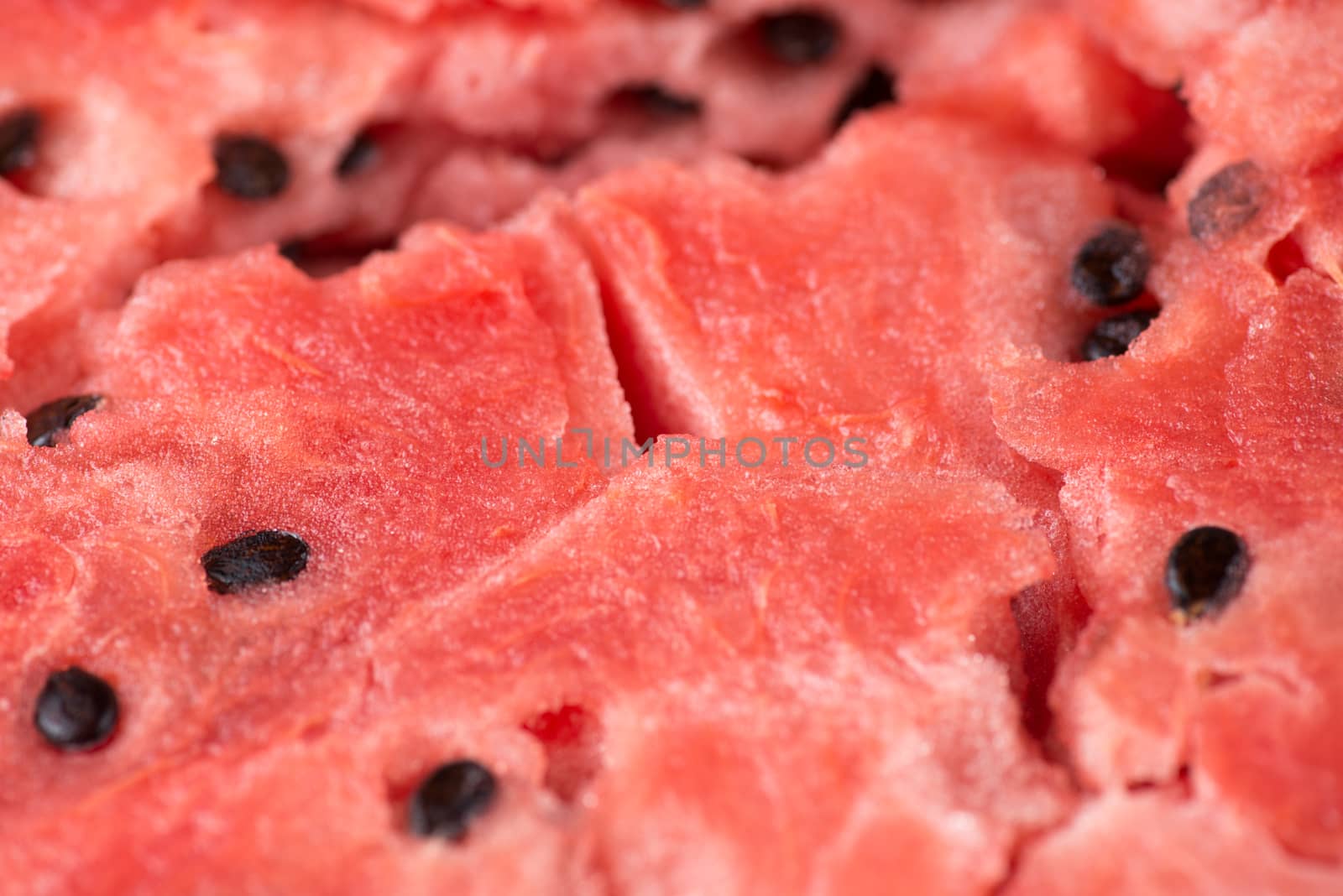 ripe watermelon flesh closeup macro texture background.