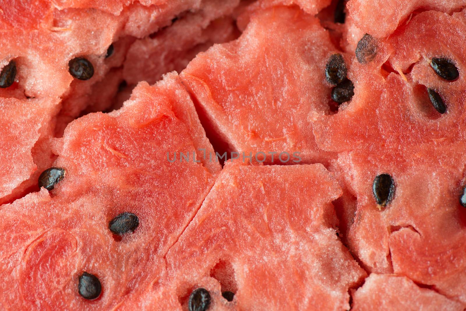 ripe watermelon flesh closeup macro texture background.