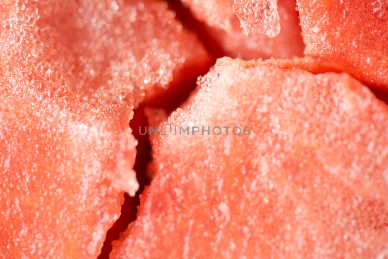 ripe watermelon flesh closeup macro texture background.